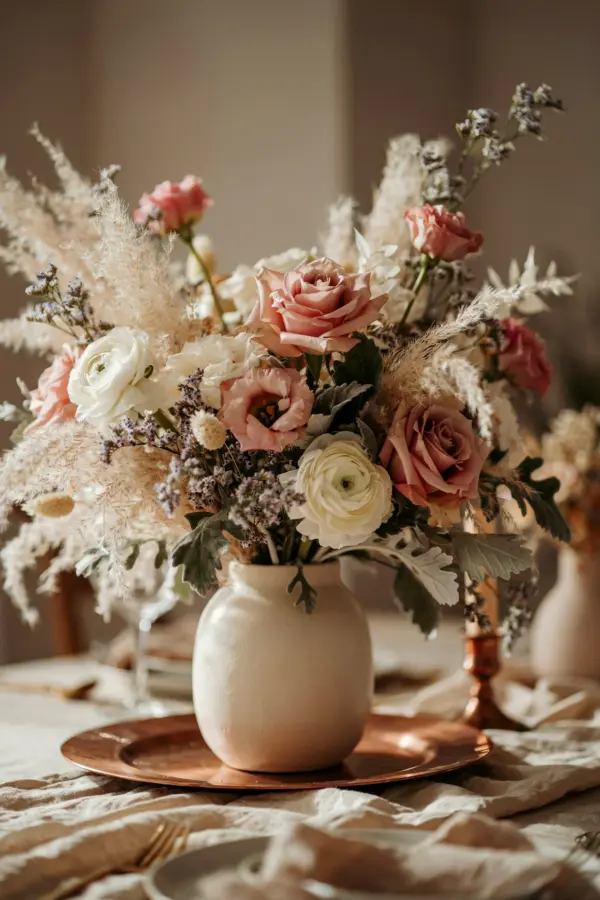 Copper accent wedding centerpiece for blue and orange wildflower theme | Elegant table decor